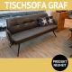 Bank GRAF ist ein Tischsofa mit Armlehnen und Metallbeinen