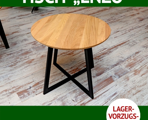 Couchtisch ENZO ist rund. Die Platte ist aus massiver Wildeiche, das Untergestell aus Metall