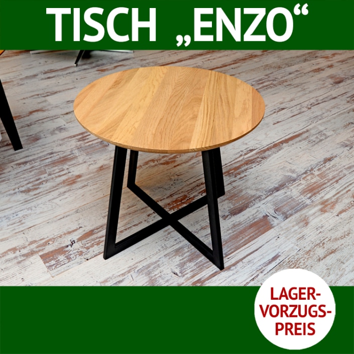 Couchtisch ENZO ist rund. Die Platte ist aus massiver Wildeiche, das Untergestell aus Metall